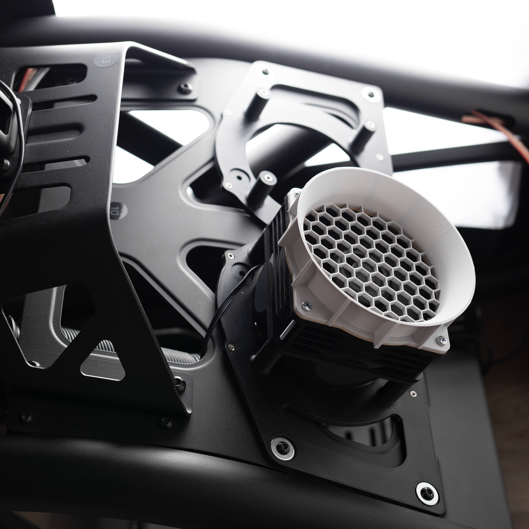 YTEM blower mounted on the rig, machined brackets carrying a printed outlet
