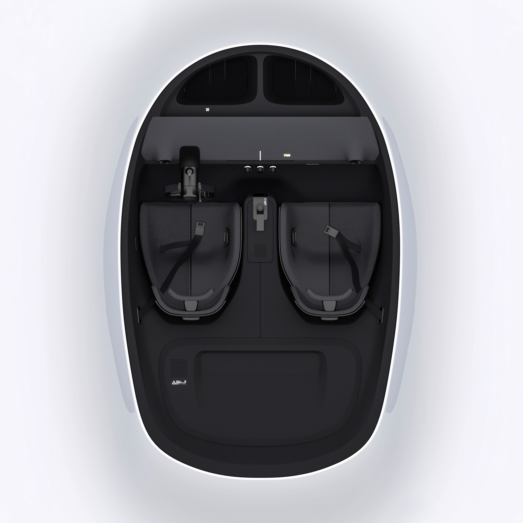 YTEM cabin from above, seats, console and packaging laid out